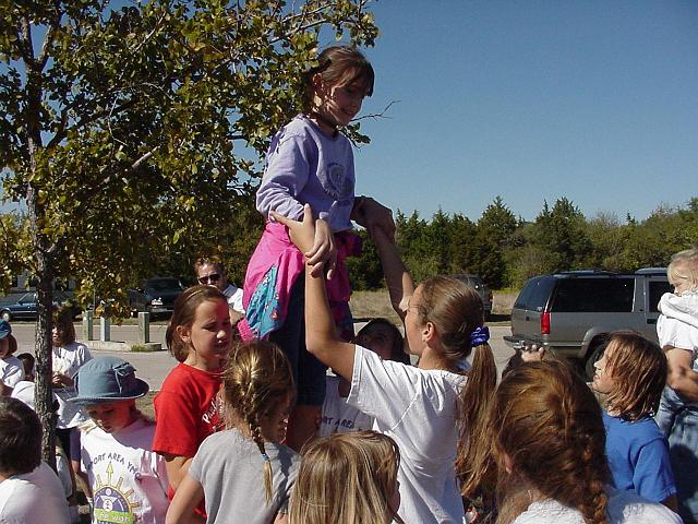 Girls holding up Christine Albrecht.JPG